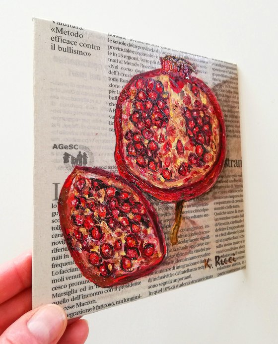 "Pomegranate on Newspaper"