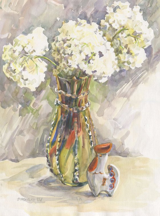 Summer still life with decorative ceramic rooster / White flowers in colorful vase