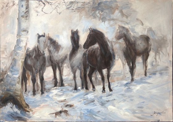 Horses in foggy landscape