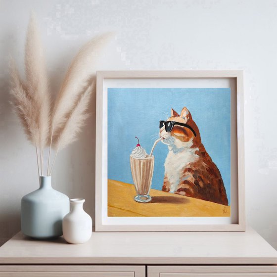 Cat drinking a milkshake