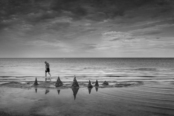 Passing by the sand castles.