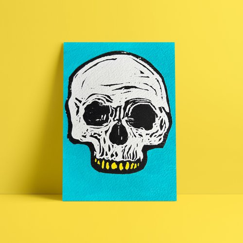 Teeny tiny skull lino print by Mr. E