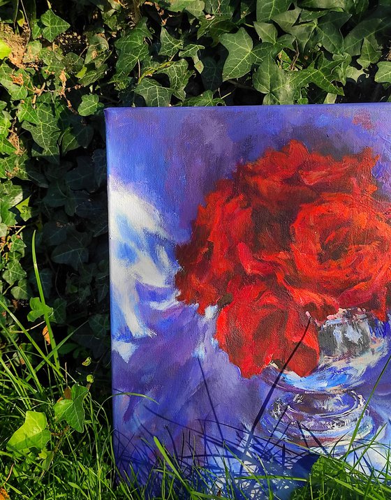 Red roses in a metal vase