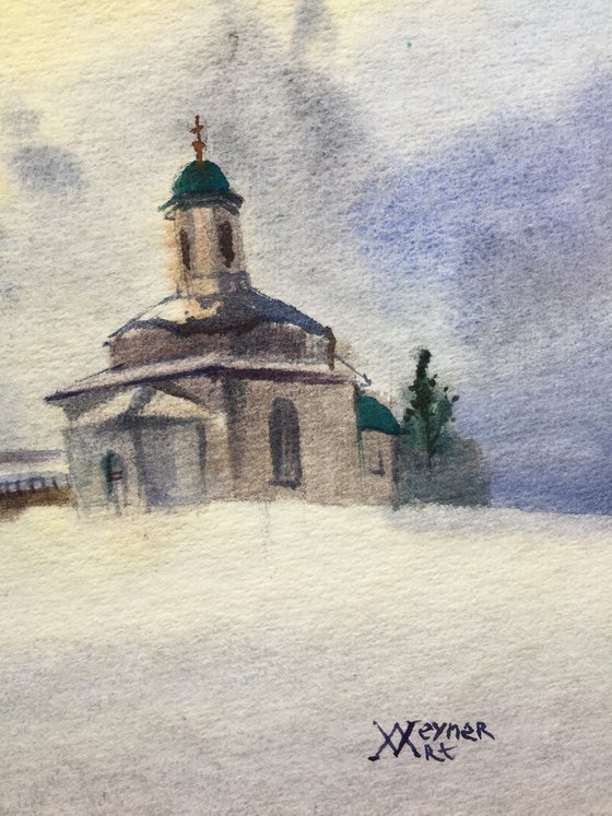 Winter landscape. Church on the hill.