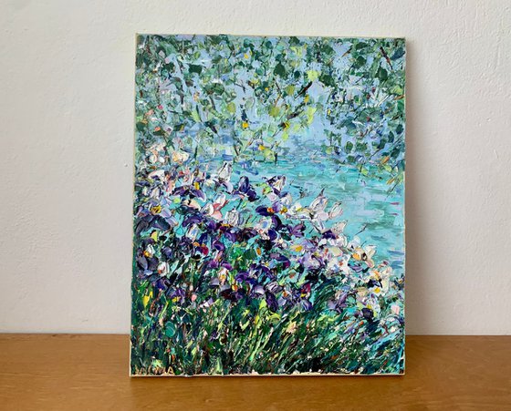 Blooming irises by the pond