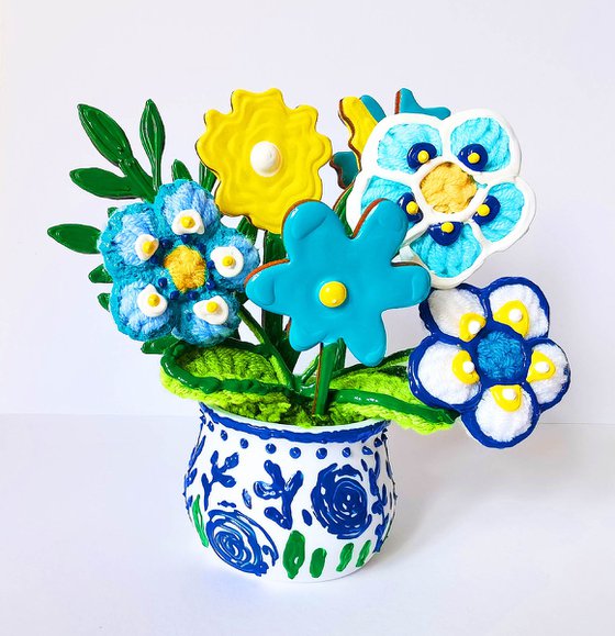 Blue crochet flowers in vase