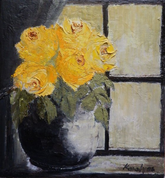 Yellow roses in a window