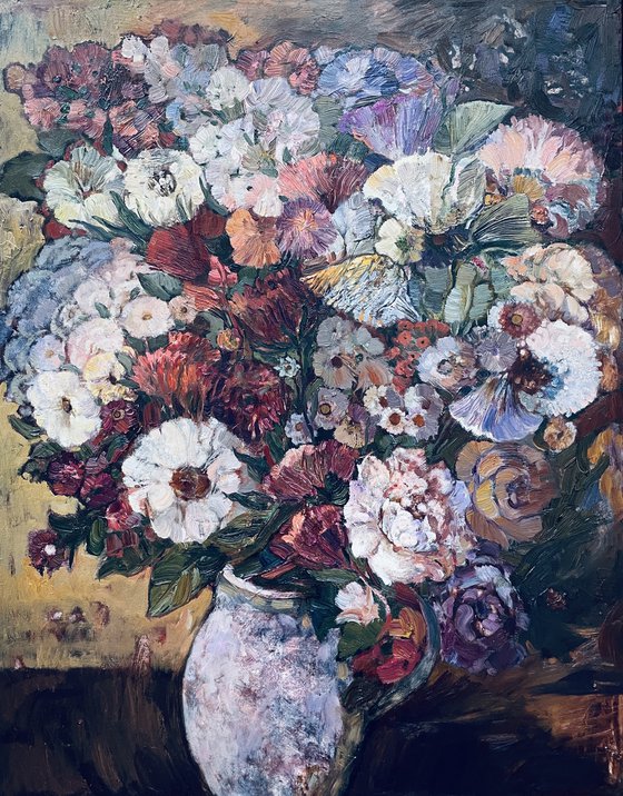 A lush bouquet in a pink vase