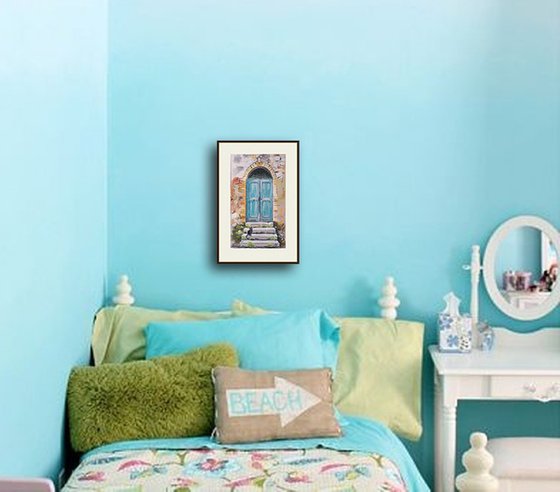 A cat at an old turquoise door