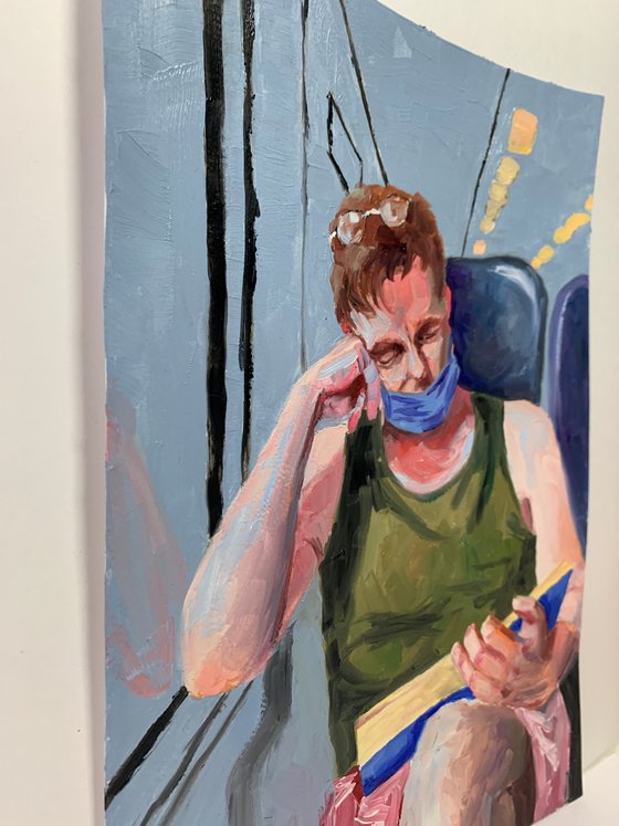 Reading man in a train.