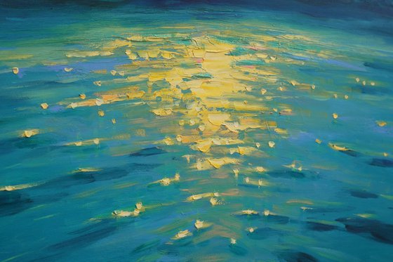 Moonrise in blue over sea