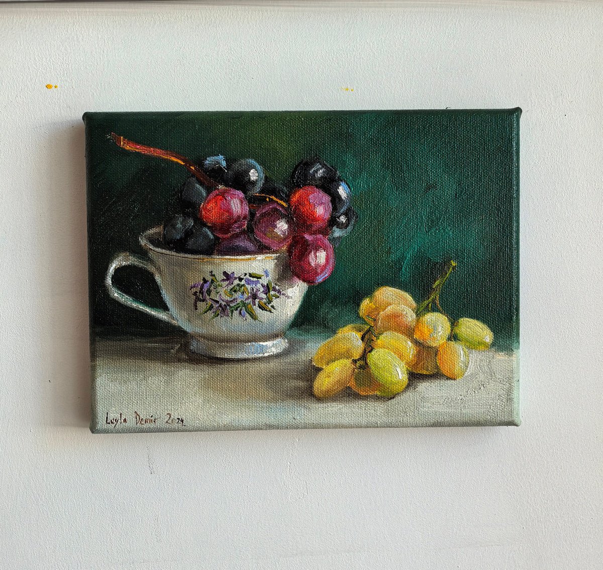 grapes in porcelain cup by Leyla Demir