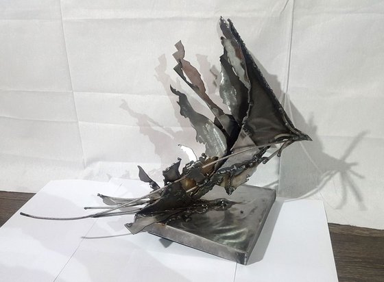 Brutalist welded iron sculpture star bird fueling the space around her  KLOSKA O romanian artist