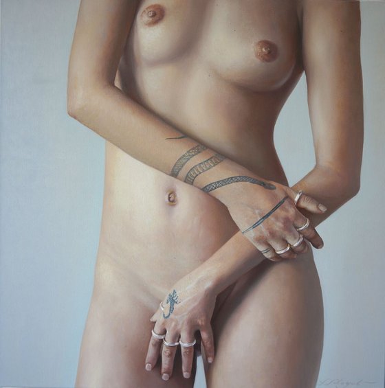 Nude standing. With hand and rings