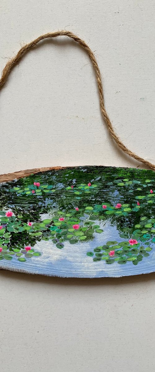 Monet’s Water lilies garden - painting on wood by Amita Dand