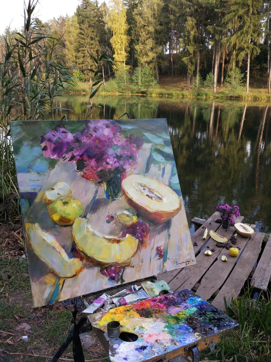 Still life with melon on the background of the lake