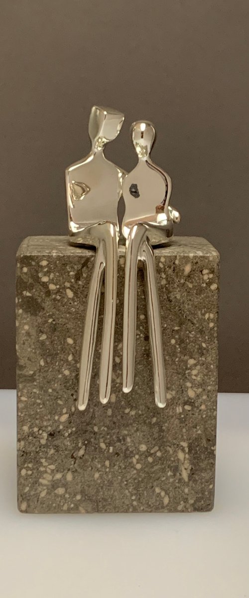 "Caress" a small  silver plated sculpture of a loving couple by Yenny Cocq