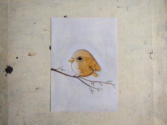 The yellow/ light brown bird