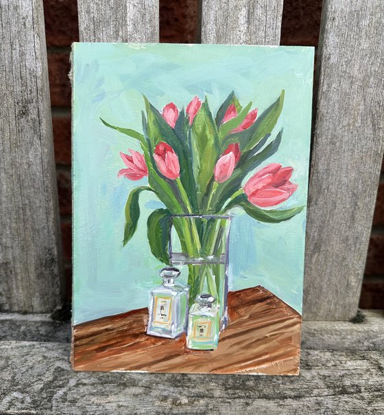 Pink tulips in glass vase