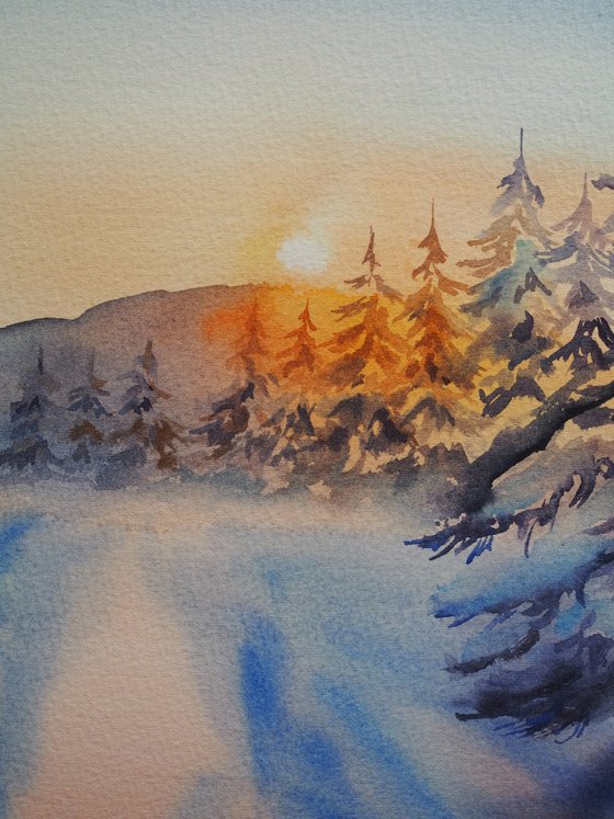 Snowy forest at sunset