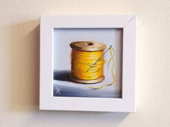 Little yellow cotton reel still life