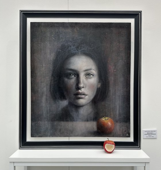 A woman and a bitten apple