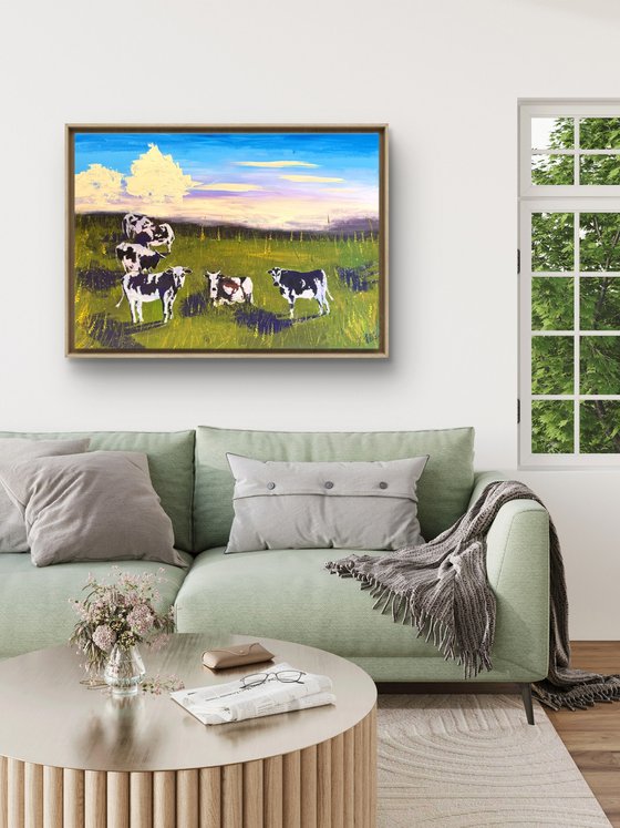 Cows grazing in the field
