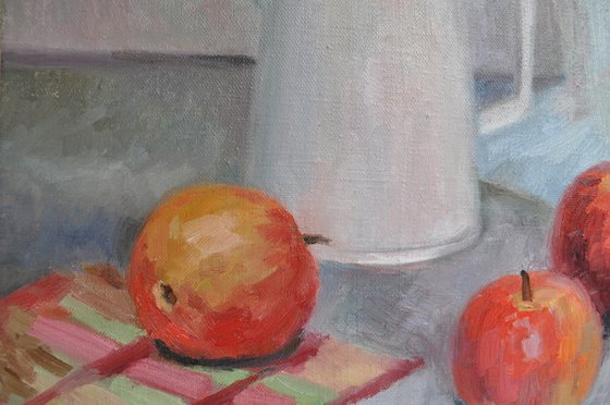 White jug and apples
