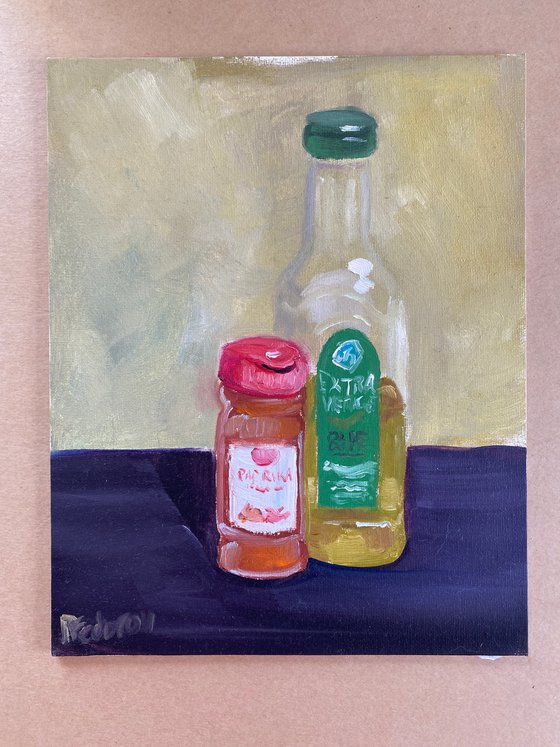 Still life with a bottle of olive oil and paprika