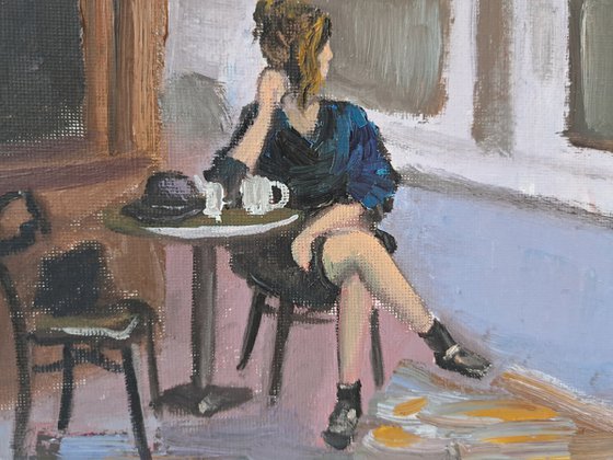 A woman in French cafe