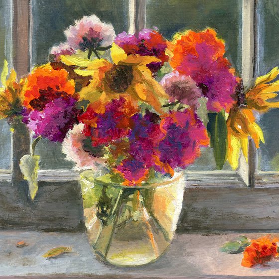 Vase of marigolds on a window