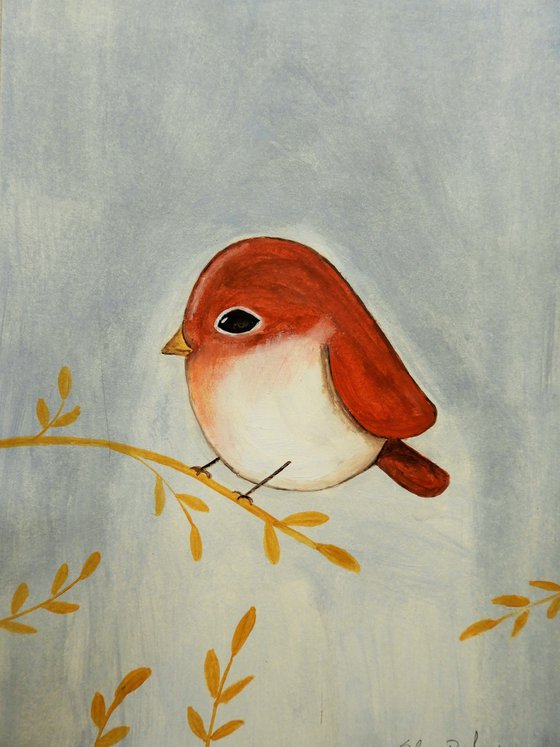 The small bird in red