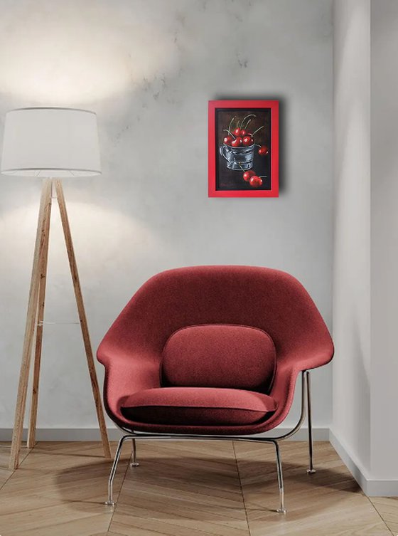 Red cherries in a metal cup