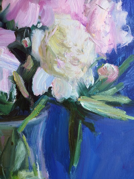 Peonies on a blue background