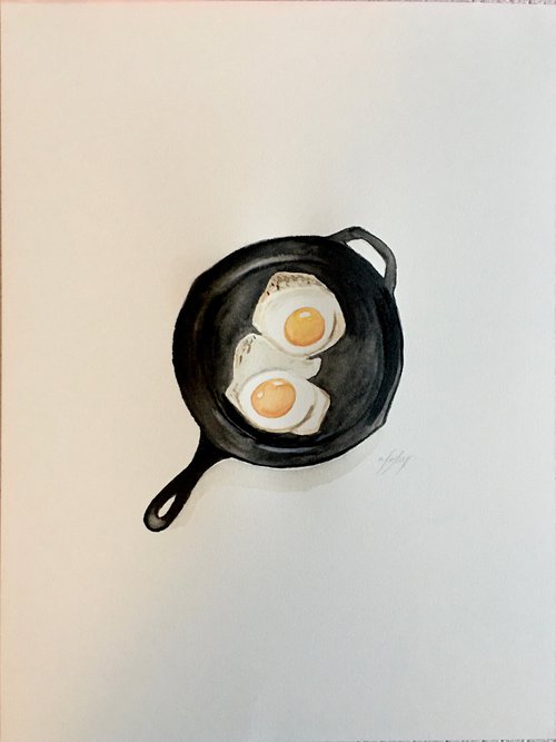 Eggs in frying pan by Amelia Taylor