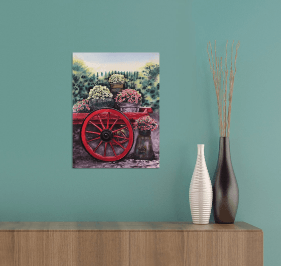 Old red cart with flowers