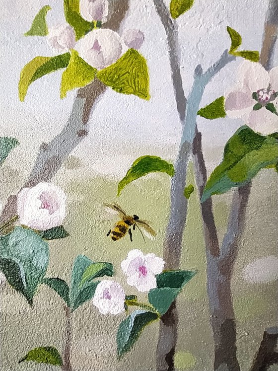 The apple trees are blooming