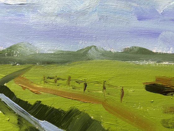 Clouds over the field and ditch