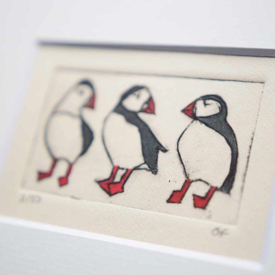 Small framed three puffins