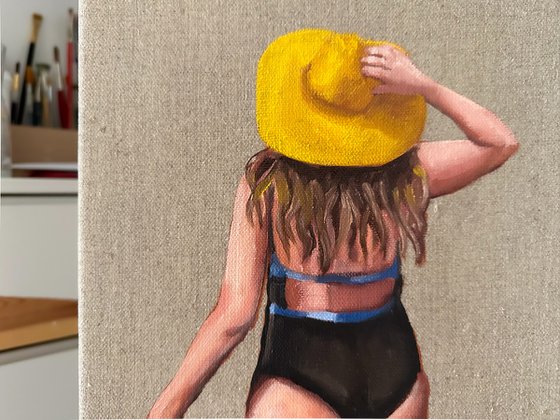 Girl in the yellow sun hat
