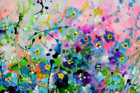 Forget me not flower field at sunrise