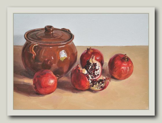 Pomegranates and an earthenware dish