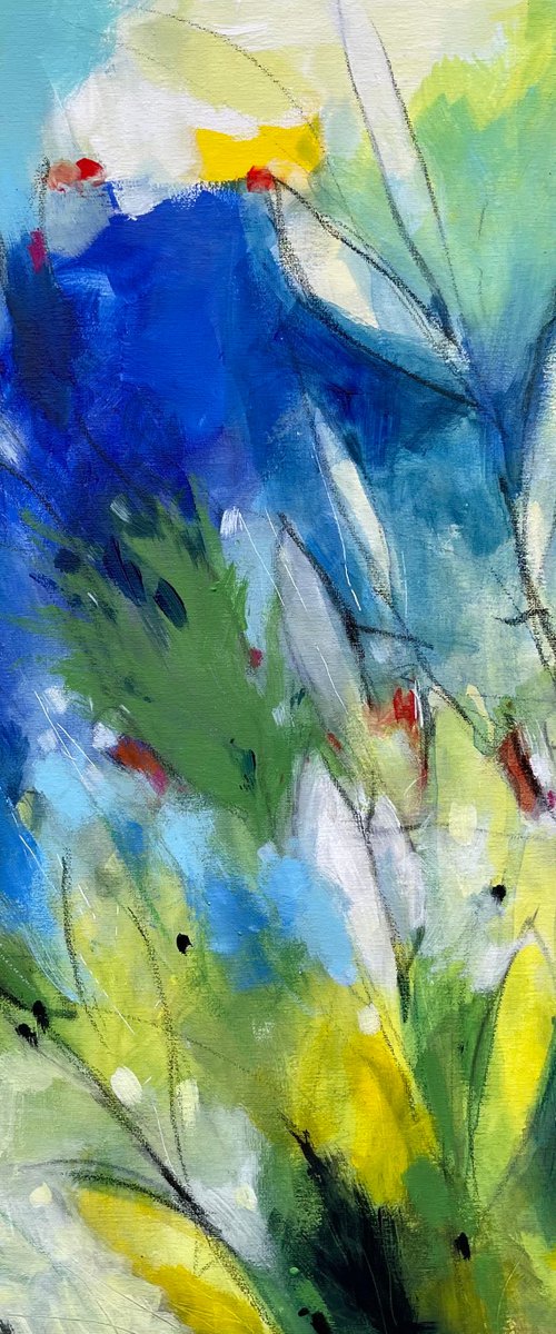 Leaves and blossom under spring’s sky by Alessandro Andreuccetti