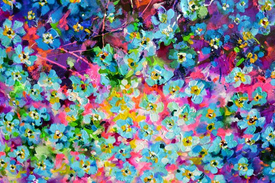 Forget me not flower field at sunrise