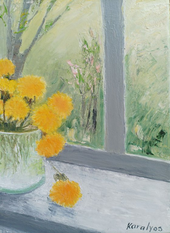 Spring with dandelions at the window