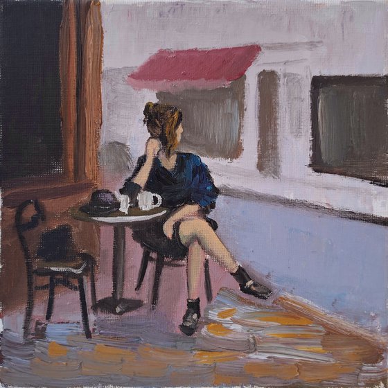 A woman in French cafe