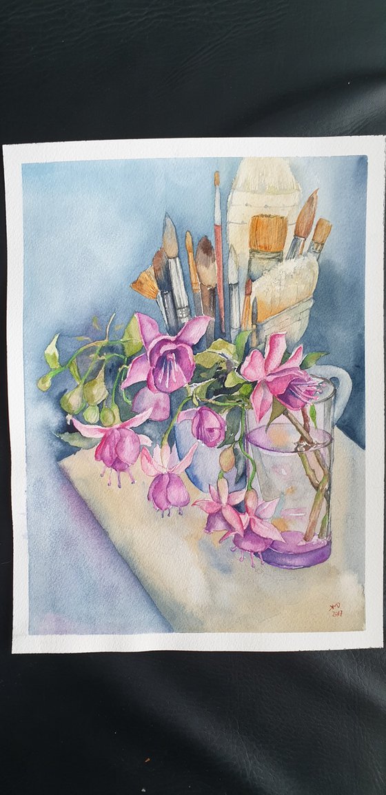 Fushia flowers on painter's table