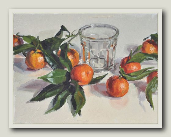 Clementines with leaves and old jam jar
