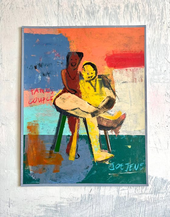 Happy Couple Sitting On A Chair
