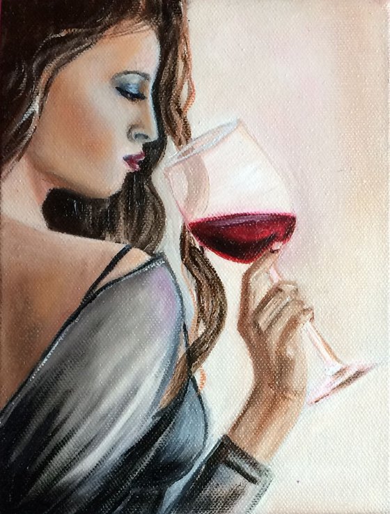 Lady with a Glass of wine. Portrait of a young Woman.